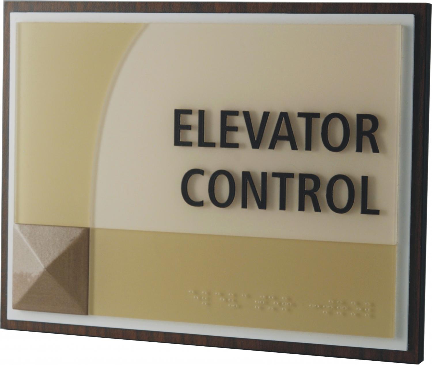 A reads "ELEVATOR CONTROL" in capital black letters. The sign features a geometric design with a textured square in the bottom left corner and curved lines in the background, and braille at the bottom of the sign.