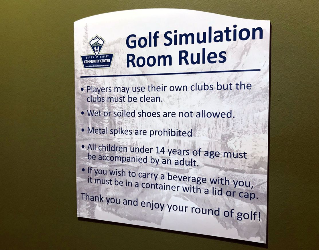 A sign titled "Golf Simulation Room Rules" at Eagle Valley Community Center. It lists: Use own clean clubs, no wet/soiled shoes or metal spikes, children under 14 must be with an adult, and beverages must be in covered containers. Ends with a thank you message.