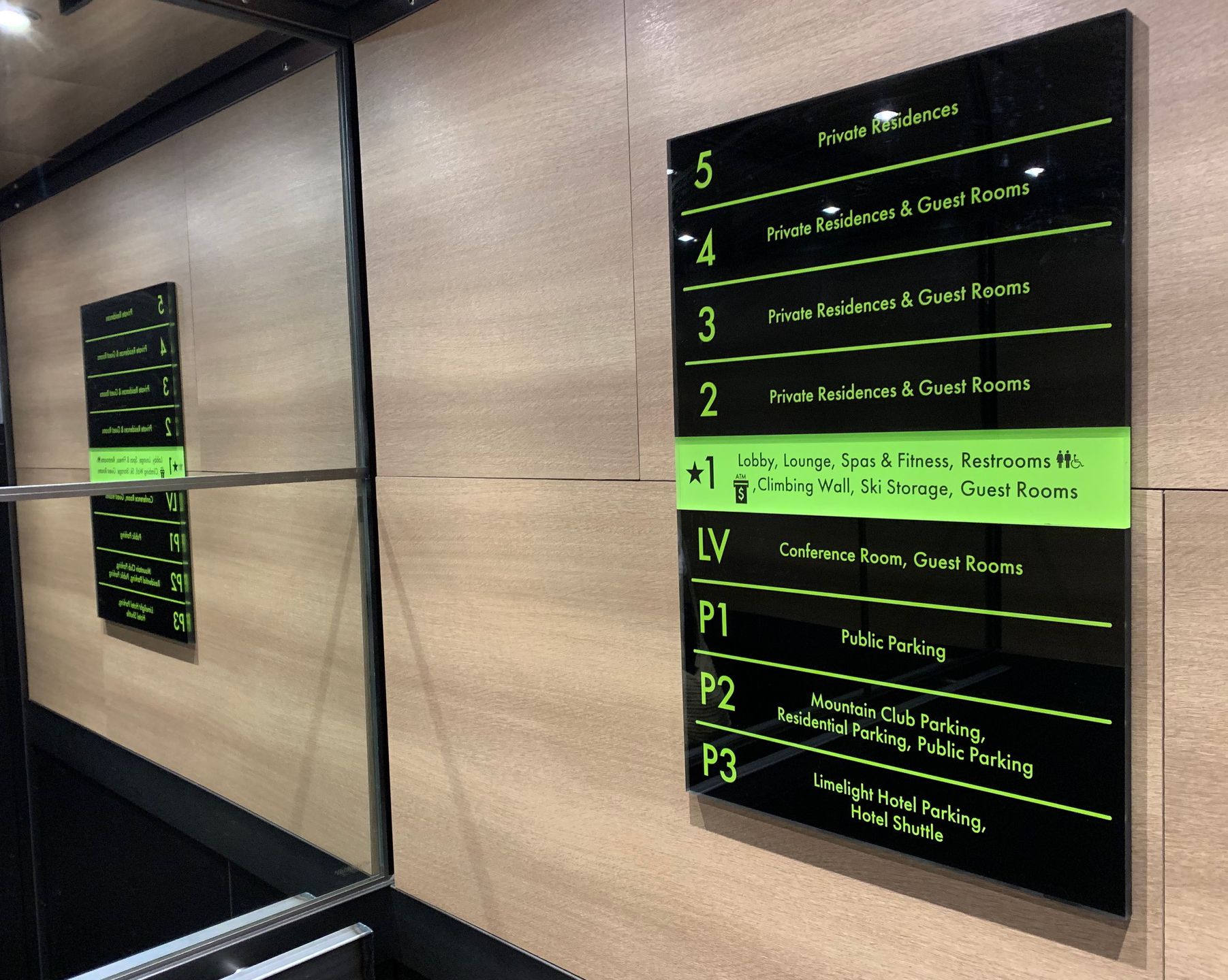 A directory sign in an elevator with floors listed: P3 for Limelight Hotel Parking and Hotel Shuttle; P2 for Mountain Club Parking; P1 for Public Parking; LV for Conference Room; 1 for Lobby, Lounge, Spas & Fitness, Guest Rooms; 2-5 for Private Residences & Guest Rooms.