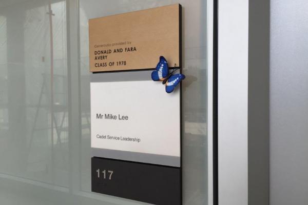 Etched zinc ADA signs incorporating donor recognition.