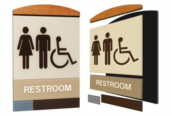 Generic restroom signs with gender and accessibility symbols on a wooden and metallic design.