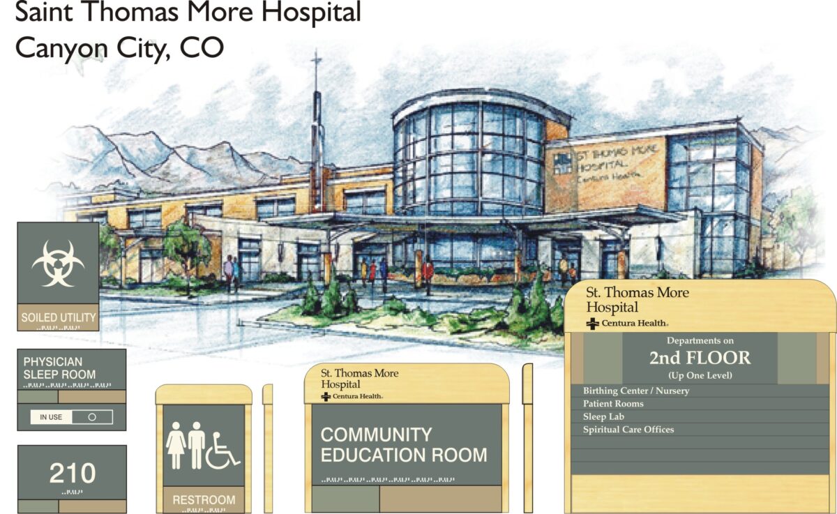 An illustration showing Saint Thomas More Hospital in Canyon City, CO. The hospital features a modern glass facade with mountainous scenery in the background. Various hospital signs are displayed below the illustration, indicating facilities and location details.