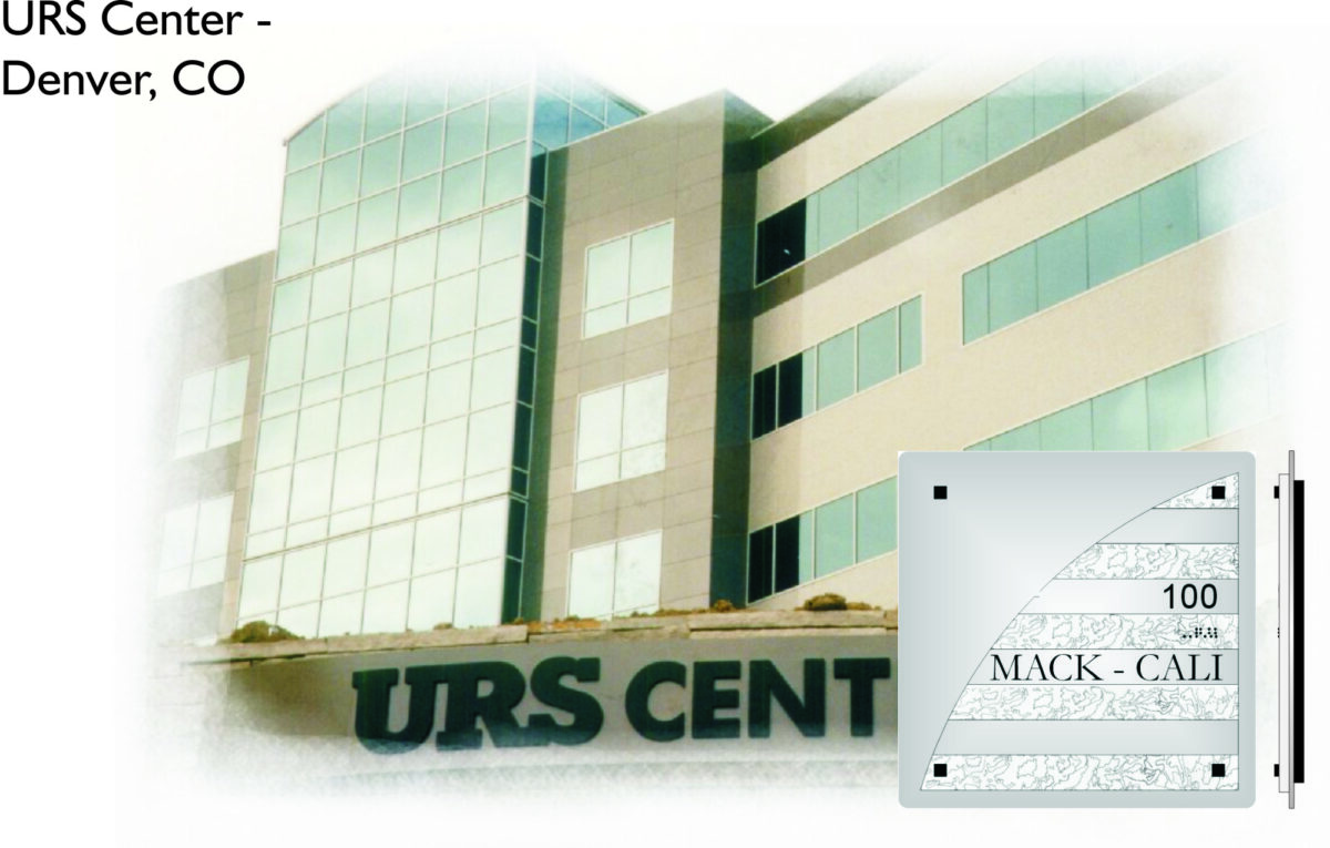 The image shows the URS Center building in Denver, CO. It's a modern structure with large glass windows and a sleek design. There is a sign in the building that reads "100 MACK-CALI" in block letters, and the overall atmosphere is professional.