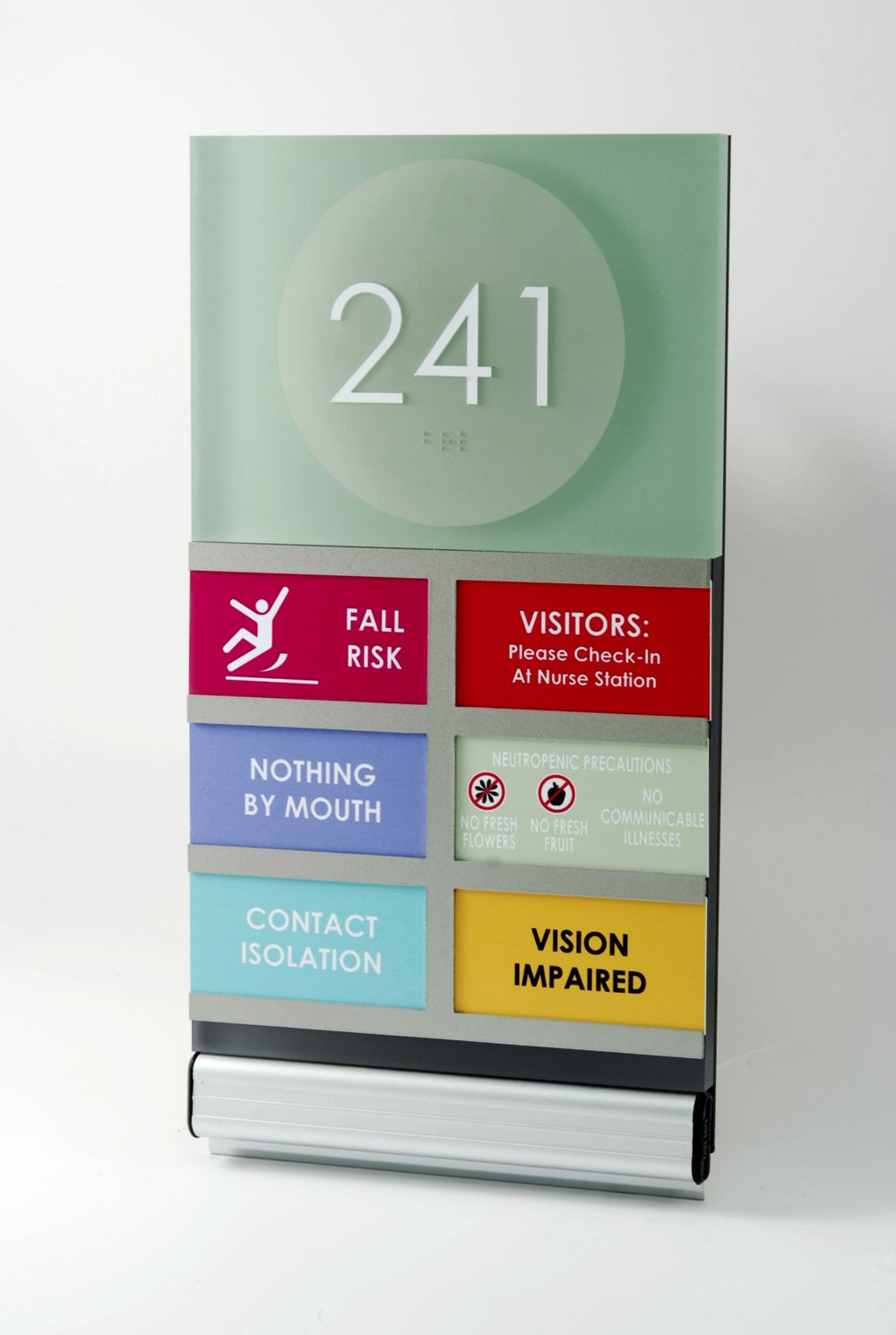 A room sign displaying "241" at the top, followed by panels indicating "FALL RISK" (red with a falling figure icon), "VISITORS: Please Check-In at Nurse Station" (red with two visitor icons), "NOTHING BY MOUTH" (purple), "CONTACT ISOLATION" (blue), and "VISION IMPAIRED" (yellow).
