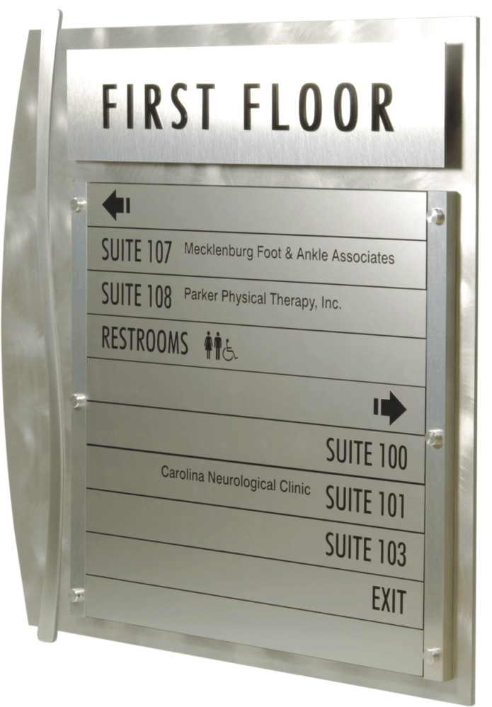 A first floor directory on the right provides a list of locations specifically for the first floor including directional arrows and icons for Restrooms.