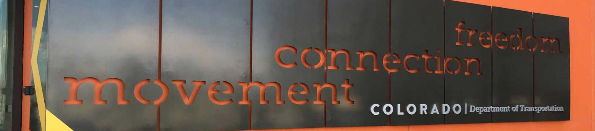 A panoramic image of a wall sign from the Colorado Department of Transportation