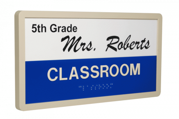 A classroom door sign indicating '5th Grade, Mrs. Roberts' with a blue horizontal stripe.
