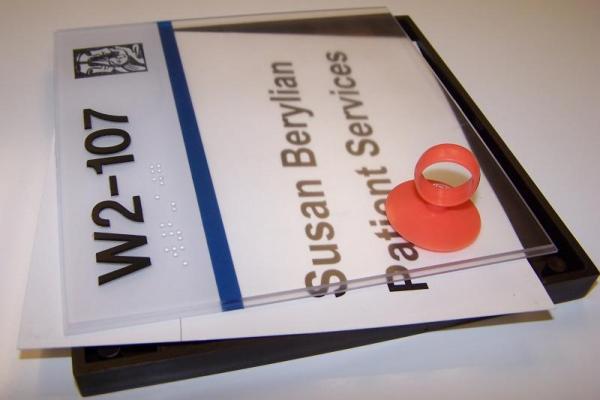 Office door sign reading 'Susan Berylian, Patent Services'