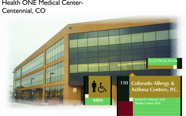 A large brick medical building with a sign reading "Health ONE Medical Center - Centennial, CO." There are smaller signs denoting "Men," "Electrical Room," and "Colorado Allergy & Asthma Centers, P.C." along with names Joanne M. Vitanza, M.D., and Martha Costanzi, M.D.