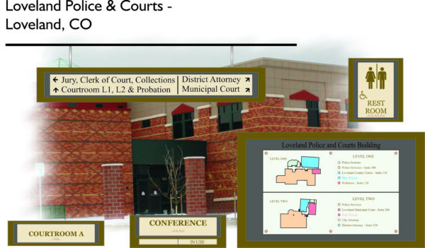 Exterior of Loveland Police & Courts building in Loveland, CO. Signs indicate locations for Jury, Clerk of Court, District Attorney, Municipal Court, and Courtrooms. A floor plan map shows different levels and rooms. There's also a rest room sign.