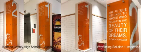 A brightly lit hallway with white walls and orange lockers labeled 2 and 1. The lockers display a quote by Eleanor Roosevelt: "The future belongs to those who believe in the beauty of their dreams." The setting is identified as a high school.
