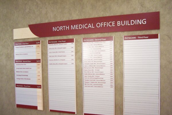 A directory sign for the North Medical Office Building. The sign consists of four panels: the first showing physician names, the second listing offices on the first floor, the third detailing offices on the second floor, and the fourth for the third floor.